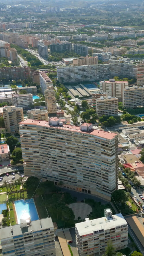 Aerial drone view of the buildings in Benidorm, Spain in daylight. Vertical - Starpik Stock