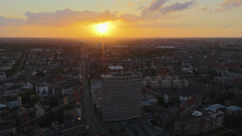 Aerial drone view of the buildings in Copenhagen, Denmark at sunset - Starpik Stock