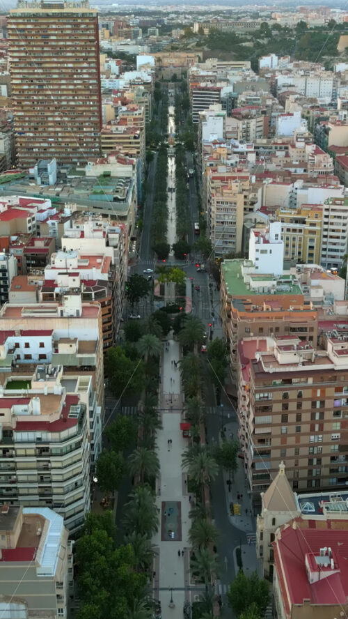 Aerial drone view of the buildings in Valencia, Spain in daylight. Vertical - Starpik Stock