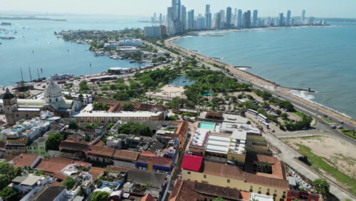 Aerial drone view of the historic center of Cartagena, Colombia alongside the Caribbean coast and promenade in daylight - Starpik Stock