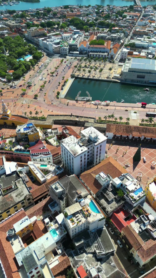 Aerial drone view of the historic center of Cartagena, Colombia alongside the Caribbean coast and promenade in daylight. Vertical - Starpik Stock