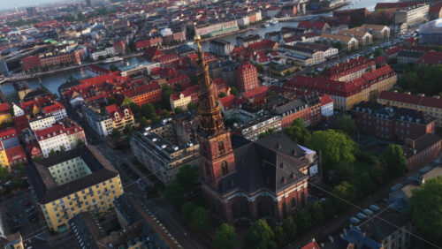 Aerial drone view of the iconic spiral tower of the Church of Our Saviour in Copenhagen, Denmark - Starpik Stock