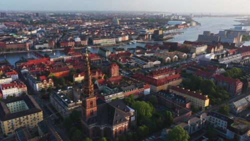 Aerial drone view of the iconic spiral tower of the Church of Our Saviour in Copenhagen, Denmark - Starpik Stock