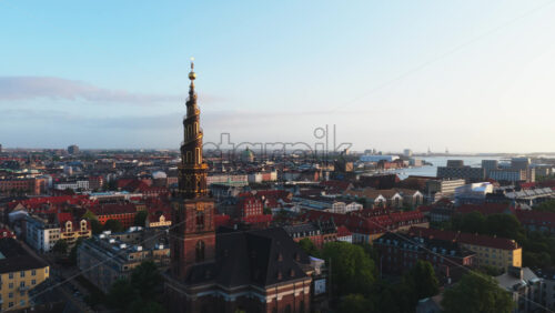 Aerial drone view of the iconic spiral tower of the Church of Our Saviour in Copenhagen, Denmark - Starpik Stock