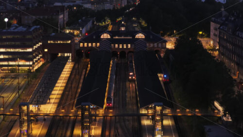 Aerial drone view of the platforms and historic station building, Copenhagen, Denmark - Starpik Stock