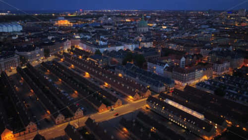 Aerial drone view over the historic Nyboder houses with Frederiks Church visible, in Copenhagen, Denmark - Starpik Stock