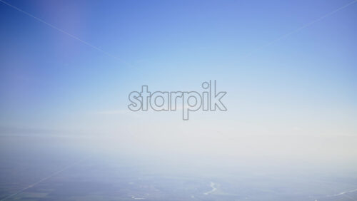 Aerial view of fields and towns and the blue sky above - Starpik Stock