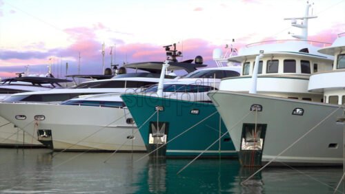 Antibes, France – July 2, 2025: Multiple white boats docked in the Port Vauban at sunset - Starpik Stock