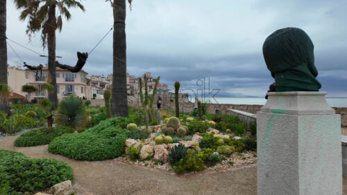 Antibes, France – July 20, 2025: People walking on the coast, near the bronze sculptures by Nicolas Lavarenne - Starpik Stock