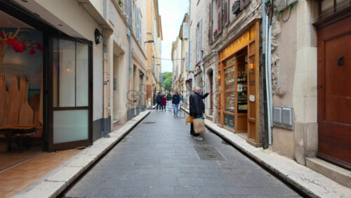 Antibes, France – July 20, 2025: People walking on the streets of the city on a cloudy day - Starpik Stock