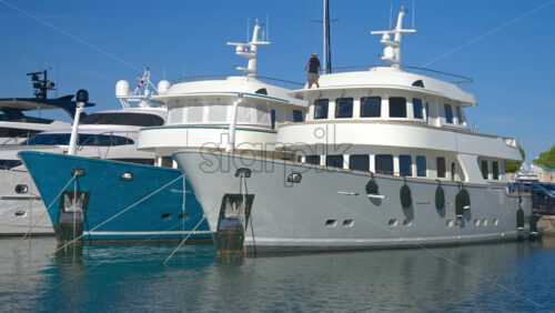 Antibes, France – June 7, 2025: Multiple white boats docked in the Port Vauban in daylight - Starpik Stock