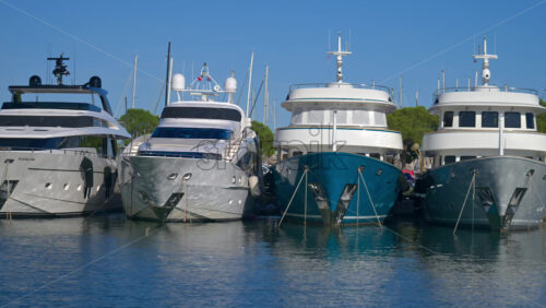 Antibes, France – June 7, 2025: Multiple white boats docked in the Port Vauban in daylight - Starpik Stock