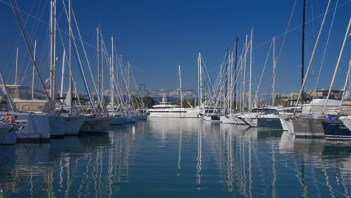 Antibes, France – June 7, 2025: Multiple white boats docked in the Port Vauban in daylight - Starpik Stock