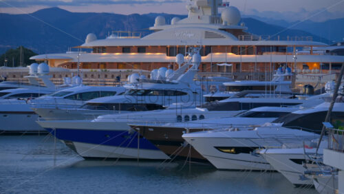 Antibes, France – June 7, 2025: Multiple white boats docked in the Port Vauban in the evening - Starpik Stock