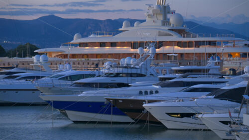 Antibes, France – June 7, 2025: Multiple white boats docked in the Port Vauban in the evening - Starpik Stock