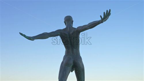 Antibes, France – June 8, 2025: Bronze sculpture “Grand Defi” by Nicolas Lavarenne with the sea in the background - Starpik Stock