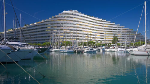 Boats docked in the Marina Baie des Anges in Villeneuve-Loubet, France in daylight - Starpik Stock