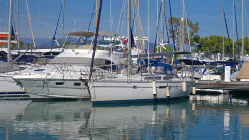 Boats docked in the Marina Baie des Anges in Villeneuve-Loubet, France in daylight - Starpik Stock