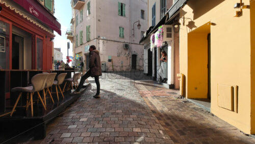 Cannes, France – August 4 2025: People walking on the streets of the city in daylight - Starpik Stock