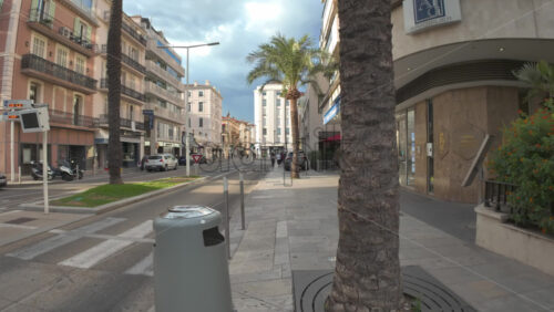 Cannes, France – July 10, 2025: People walking on the streets of the city in daylight - Starpik Stock