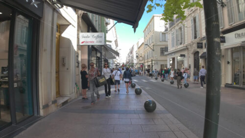 Cannes, France – July 10, 2025: People walking on the streets of the city in daylight - Starpik Stock