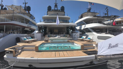Cannes, France – July 10, 2025: View of boats docked in the Cannes marina near a red carpet - Starpik Stock