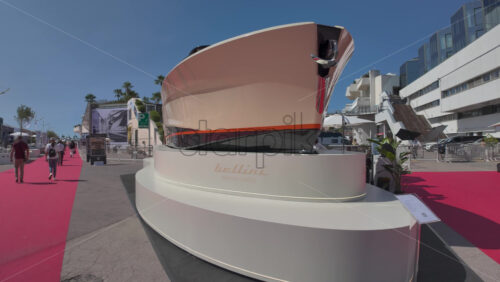 Cannes, France – July 10, 2025: Visitors browsing boats on either side of a red carpet - Starpik Stock
