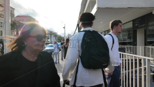 Cannes, France – July 12, 2025: People walking on the streets of the city on a sunny day - Starpik Stock