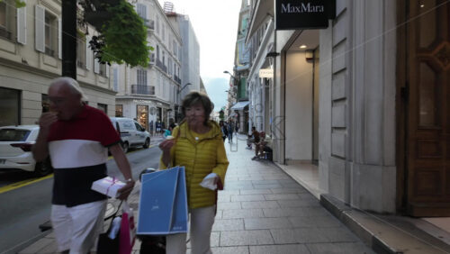 Cannes, France – July 12, 2025: People walking on the streets of the city on a sunny day - Starpik Stock
