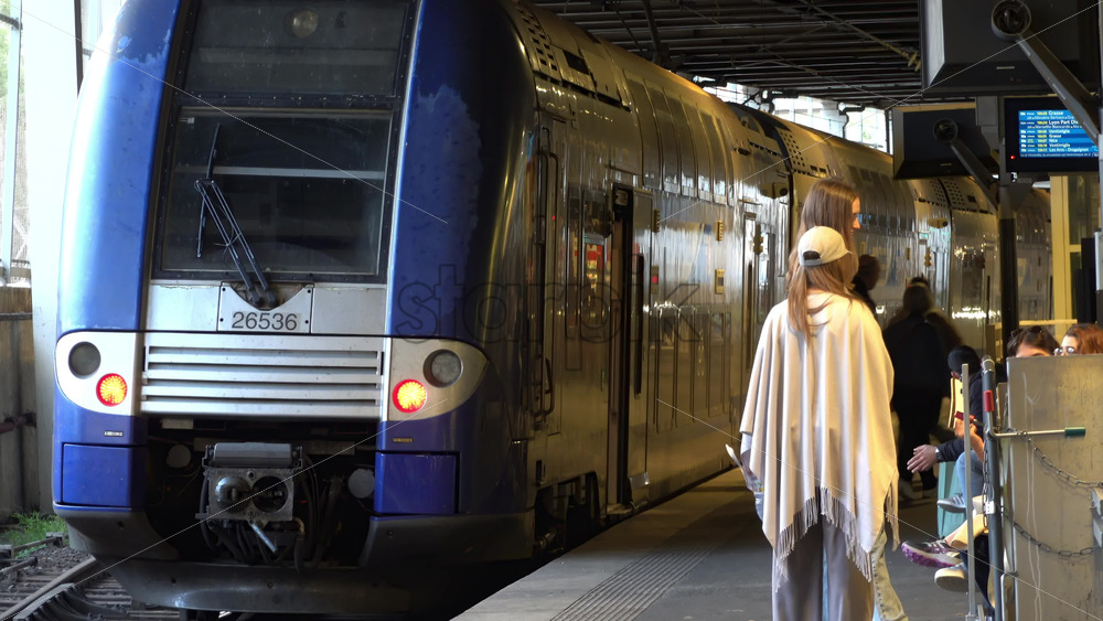 Cannes, France – July 2, 2025: Regional French train at a station platform as passengers board and prepare for departure - Starpik Stock