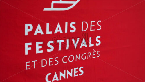 Cannes, France – July 6, 2025: Close-up of the red signage for Palace of Festivals and Congresses of Cannes - Starpik Stock