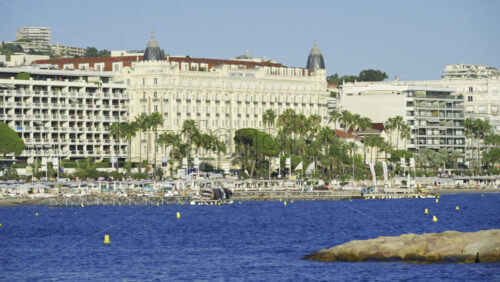 Cannes, France – June 22, 2025: Distant view of the Carlton Hotel on the coast of the Mediterranean sea - Starpik Stock