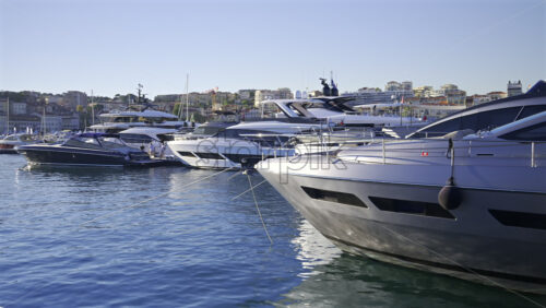 Cannes, France – June 22, 2025: Multiple boats docked in the Cannes harbour in daylight - Starpik Stock