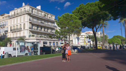 Cannes, France – June 22, 2025: People walking on the streets of the city in daylight - Starpik Stock