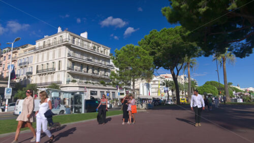 Cannes, France – June 22, 2025: People walking on the streets of the city in daylight - Starpik Stock