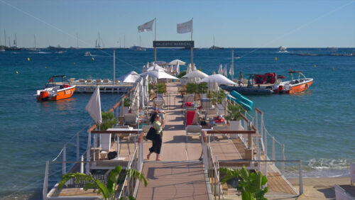 Cannes, France – June 22, 2025: View of the Barriere Le Majestic beach restaurant in daylight - Starpik Stock