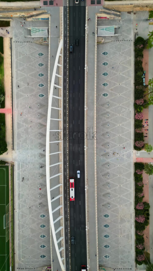 Cars and public transportation moving on the Exhibition Bridge in Valencia, Spain. Vertical - Starpik Stock
