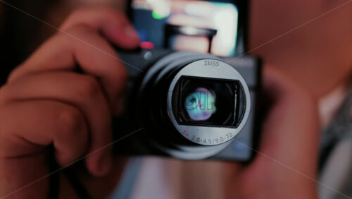 Chisinau, Moldova – August 22, 2025: Child using a digital camera, with the camera screen showing a reflection - Starpik Stock