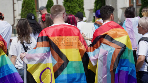 Chisinau, Moldova – June 15, 2025: People marching, holding Pride flags at the Parade in the city center - Starpik Stock