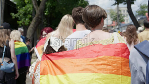 Chisinau, Moldova – June 15, 2025: People marching, holding rainbow flags at the Pride Parade in the city center - Starpik Stock