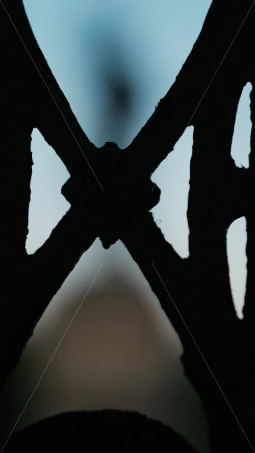 Chisinau, Moldova – June 15, 2025: Stephen the Great statue seen through the out-of-focus curves of a wrought-iron fence. Vertical - Starpik Stock