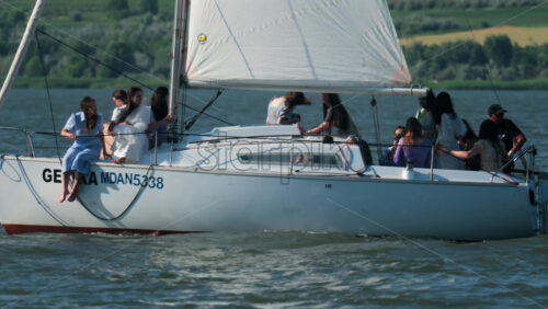 Chisinau, Moldova – June 17, 2025: A group of friends enjoying a relaxing sailing trip on a yacht during a sunny afternoon - Starpik Stock