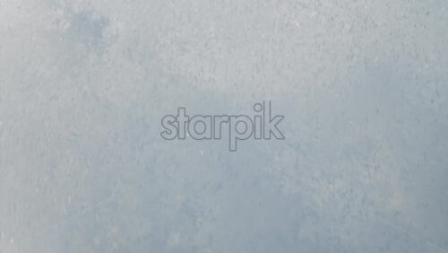 Chisinau, Moldova – June 17, 2025: A man in a black life vest riding a black jet ski at high speed across a calm body of water - Starpik Stock