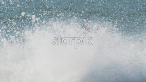 Chisinau, Moldova – June 17, 2025: A man in a black life vest riding a black jet ski at high speed across a calm body of water - Starpik Stock