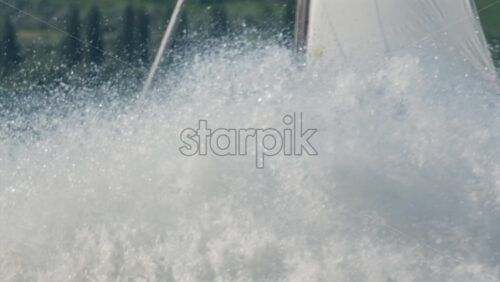 Chisinau, Moldova – June 17, 2025: A man riding a black jet ski at high speed, splashing girls on sailing trip across a calm body of water - Starpik Stock
