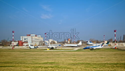 Chisinau, Moldova – March 20, 2025: Different airplanes on a field at the Chisinau International Airport - Starpik Stock