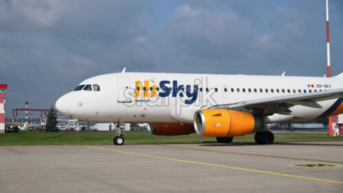 Chisinau, Moldova – March 20, 2025: View of a white HiSky airplane moving at the Chisinau International Airport - Starpik Stock