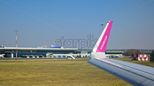 Chisinau, Moldova – March 20, 2025: Wizz Air airplane moving through the Chisinau International Airport - Starpik Stock