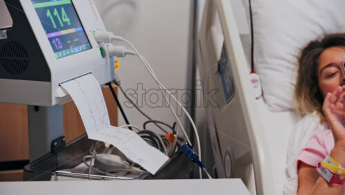 Chisinau, Moldova – May 31, 2025: Pregnant woman scrolling on her phone while doing a prenatal check-up at the doctor’s office - Starpik Stock