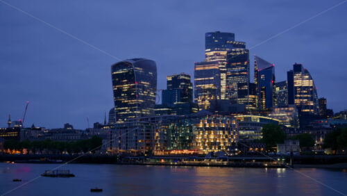 Cityscape view showing the Thames River, modern skyscrapers, including the Walkie Talkie building, and the Tower of London - Starpik Stock